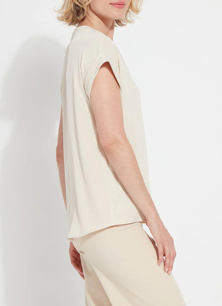 Side image of Lysse tempo short sleeve shirt in light almond. 