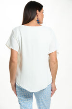 Back image of last tango short sleeve air flow top.