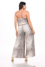 Back image of wide leg jumpsuit in ivory snake print. 