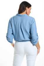 Back image of Made in Italy button and tie front top in blue jean. 