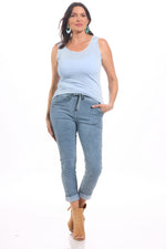 Front image of made in italy round neck light blue raw edge tank top. 