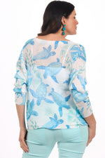 Back image of look mode white turtle printed sweater. 