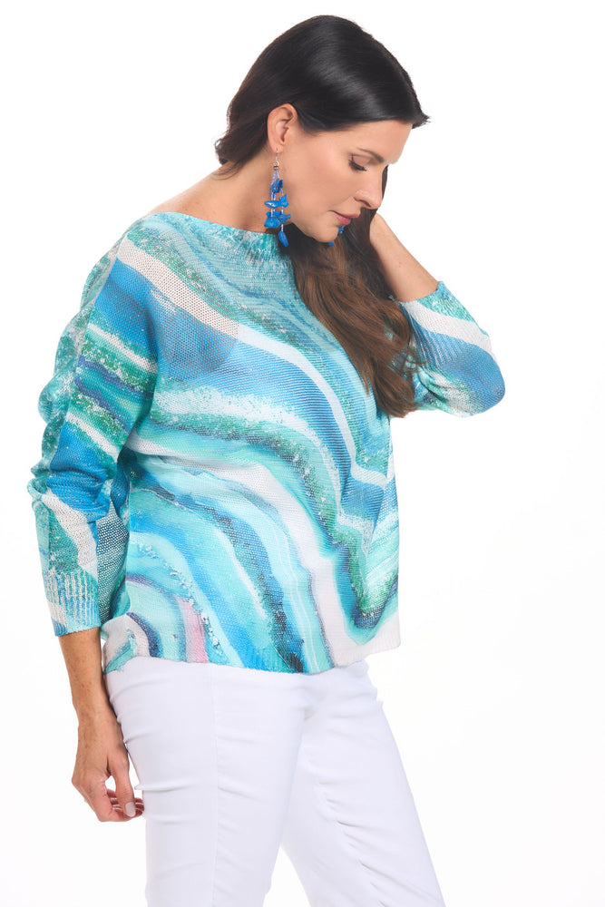 Side image of long sleeve blue wave printed sweater made in italy. 