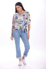 Front image of impulse drop shoulder top in multi print. 