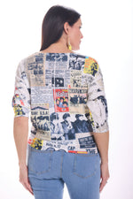 Back image of impulse drop shoulder top in multi print. 