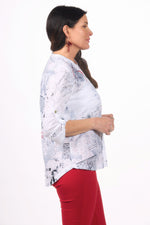 Side image of impulse pressed flower roll sleeve top.