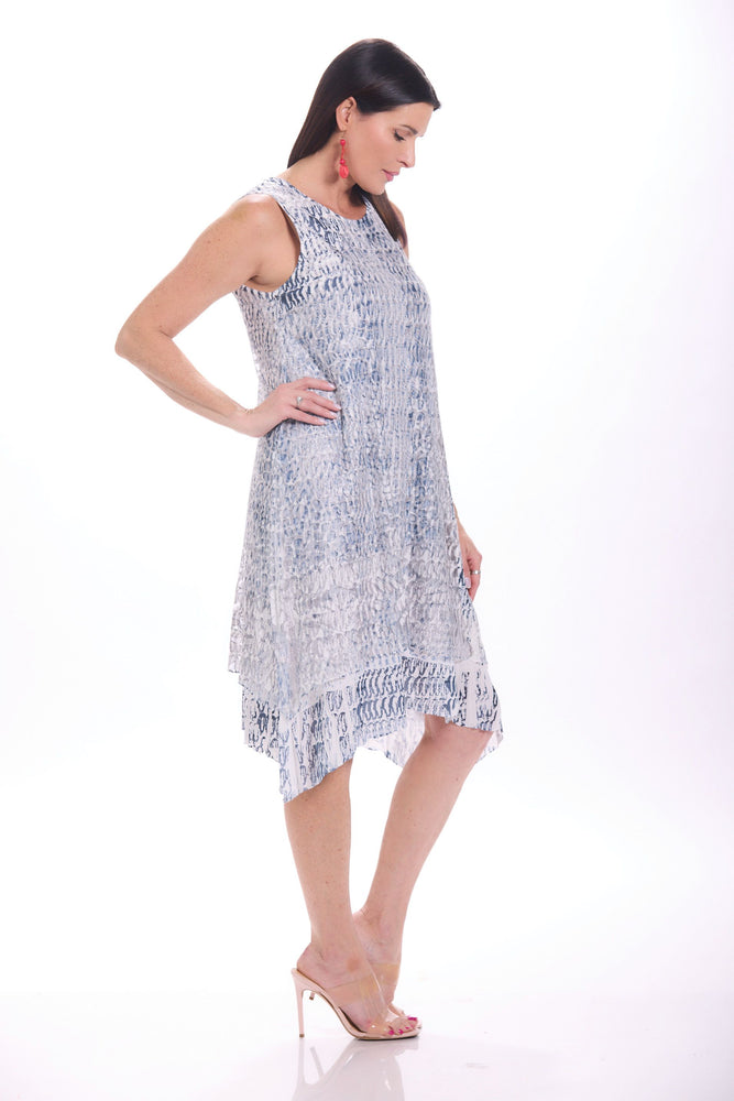 Side image of Impulse sleeveless burnout dress in coils print. 