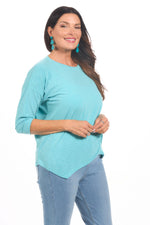 Side image of nally&millie knot top in aqua blue. 