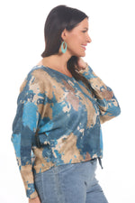 Side image of made in italy blue and taupe printed long sleeve sweater. 