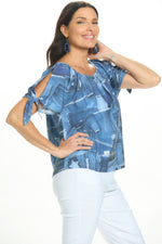 Side image of Cubism tie front top in blue pattern. 