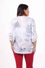 Back image of impulse pressed flower roll sleeve top.