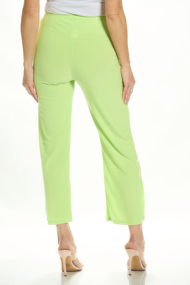 Back image of Mimozza pull on side slit ankle pants in lime green. 