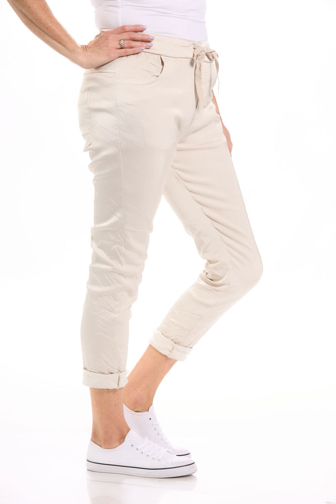 Side image of Gigi Moda Made in italy beige pull on satin pants. 