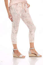 Side image of Look Mode pink swirl pull on jeggings. 