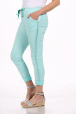 Side image of look mode pull on side rib jeggings in mint blue.