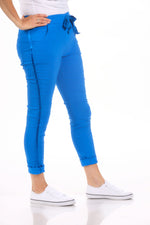 Side image of pull on jeggings in royal blue made in italy. 