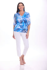 Front image of impluse hazy blue printed roll tab sleeve top. 