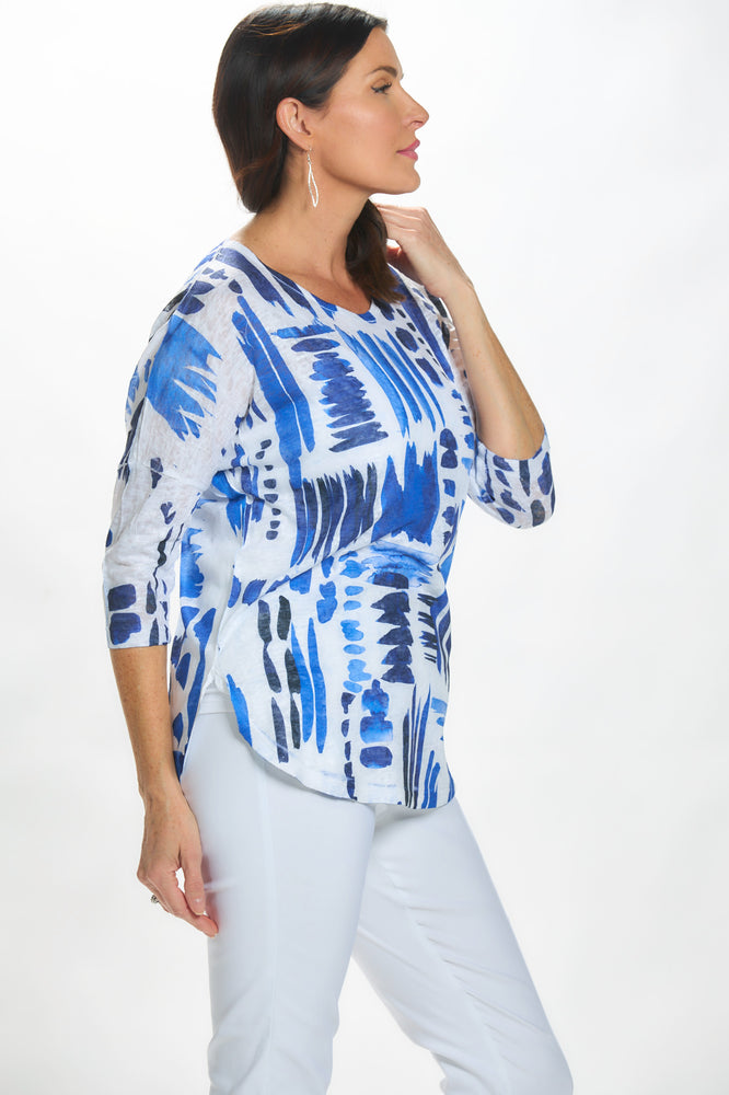 Side image of impulse round neck round hem top in navy clouds. 