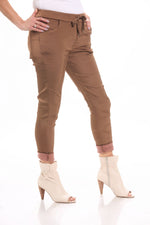 Side image of Gigi Moda pull on stain pants in rust brown. 