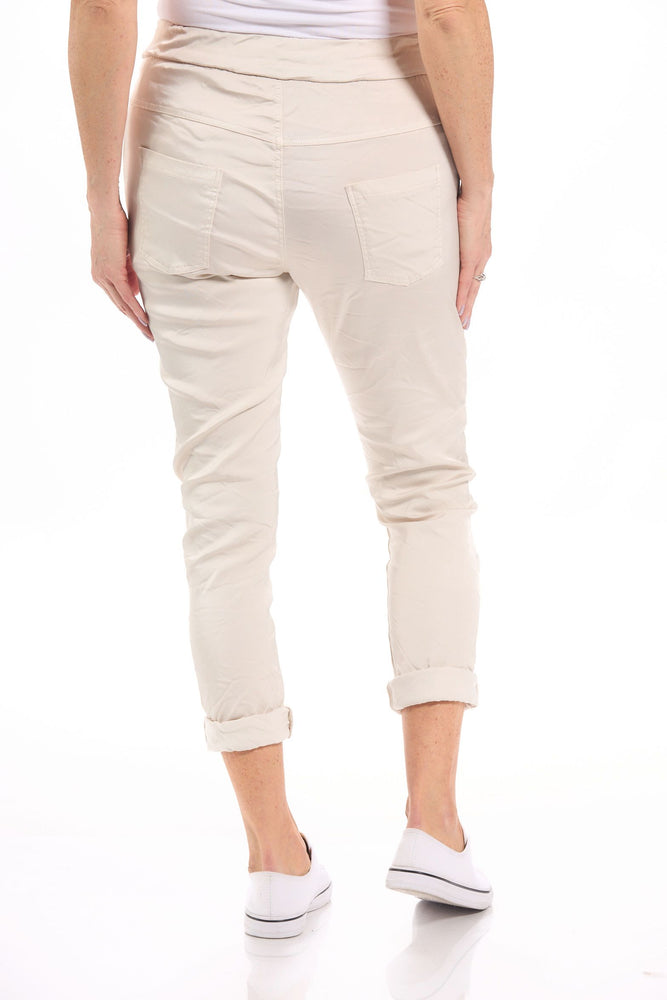 Back image of Gigi Moda Made in italy beige pull on satin pants. 