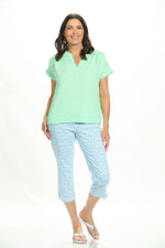 Front image of Lulu B short sleeve clear lime gauze top. 