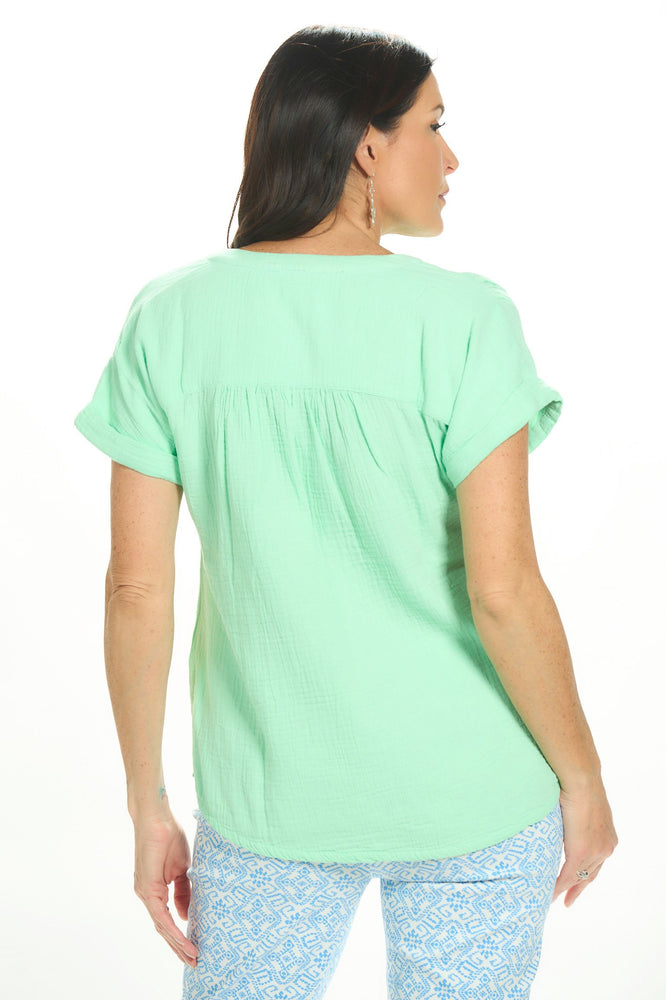 Back image of Lulu B short sleeve clear lime gauze top. 