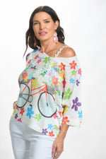 Front image of Made in Italy white flower and bike sweater. 