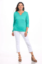 Front image of tropical green crinkle tee by shana. 