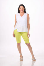 Front image of nally&millie white v neck tank with notch hem.