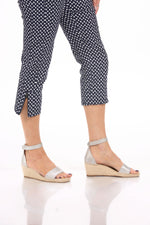 Front detail image of tribal polka dot navy pull on capri.